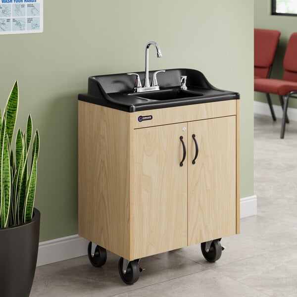 A portable hot water hand sink with a maple laminate cabinet, single basin, and wheels for mobility.