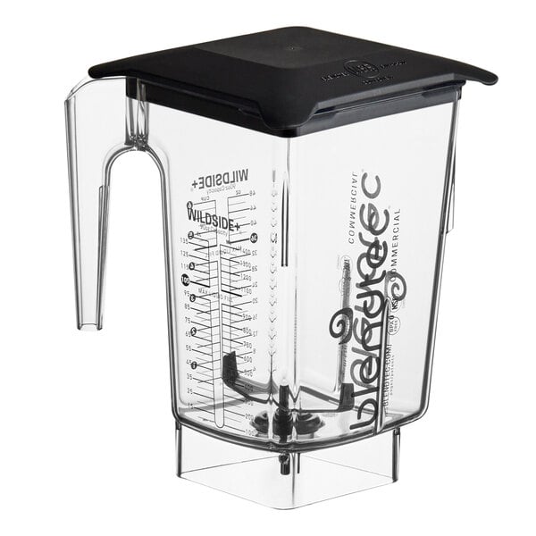 A clear Blendtec blender jar with a black lid and handle.