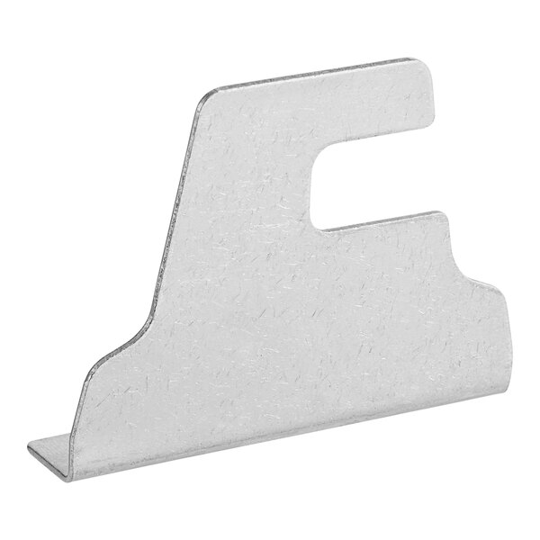 A metal door lock plate with a hole in it.