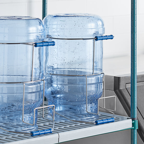 A clear plastic container with a metal wire holding it up.