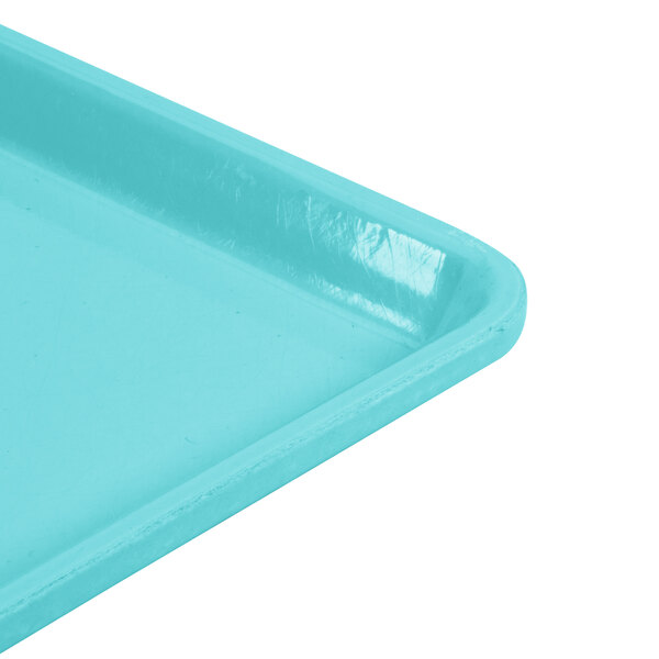 A close-up of a Robin Egg Blue Cambro dietary tray.