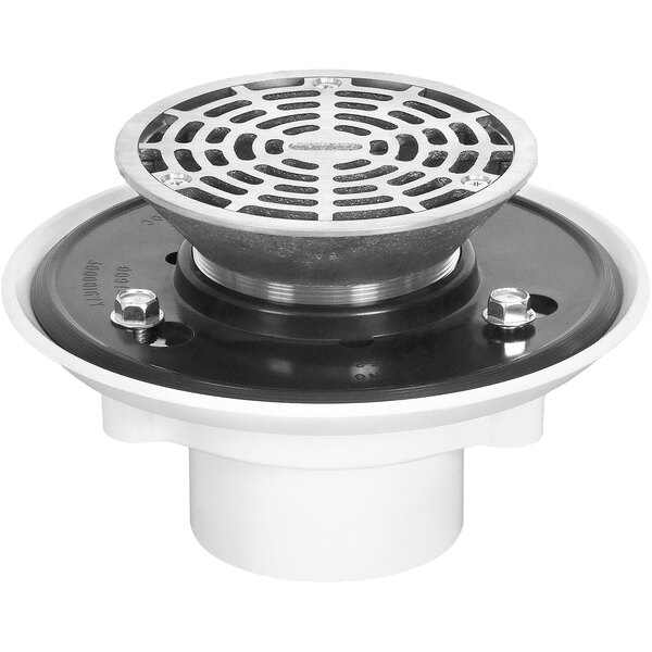 A round metal Josam floor drain with a round metal Nikaloy strainer with a black circle.