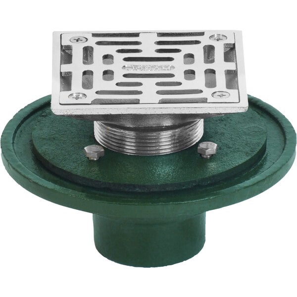 A Josam square floor drain with a green and silver metal grate.