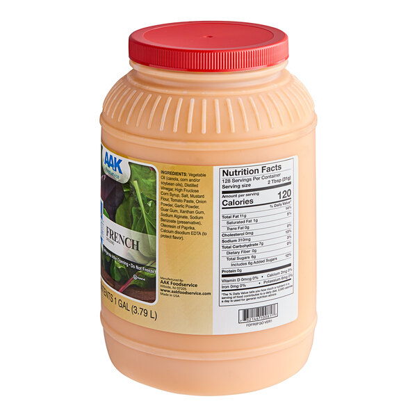 A plastic container of AAK Select French Dressing with a red lid.