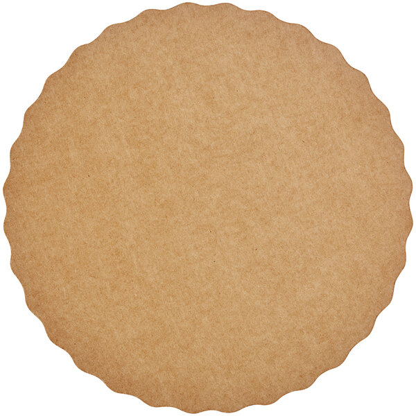 A brown circular object with a scalloped edge.