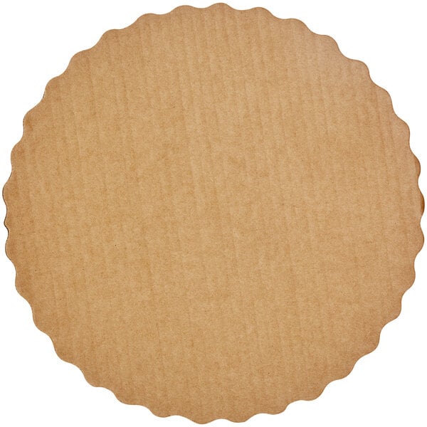 A brown circular object with a scalloped edge.