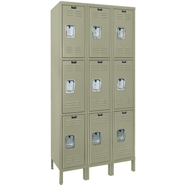 Three Hallowell tan triple tier lockers with recessed handles.