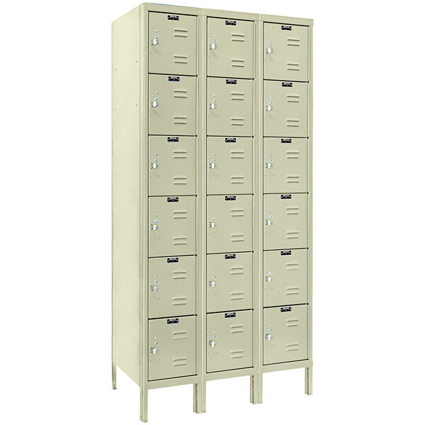 A row of tan Hallowell box lockers with many compartments.