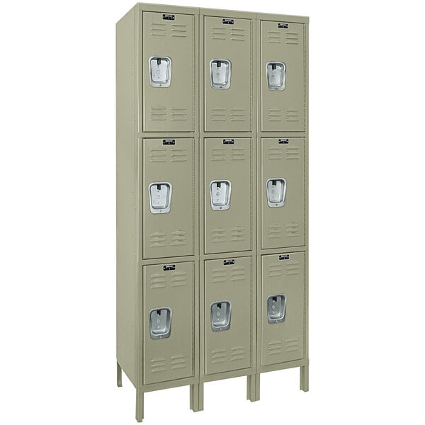 Three Hallowell tan triple lockers with recessed handles.
