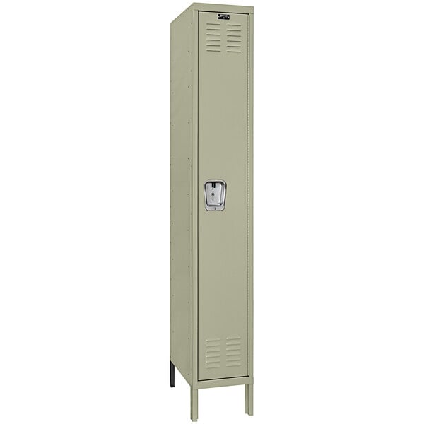 A tan metal single tier locker with a recessed silver handle.