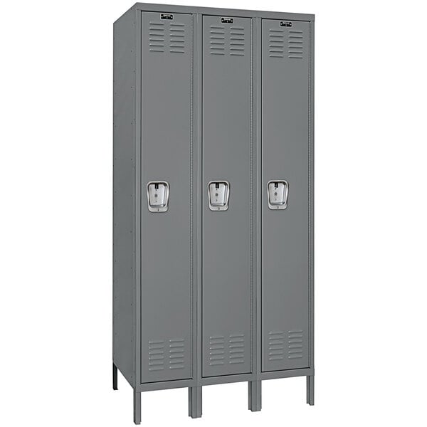 A group of gray Hallowell steel lockers with recessed handles.