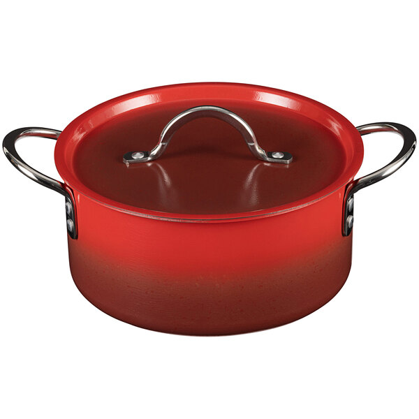 A Bon Chef Country French ombre crimson red sauce pot with a lid.