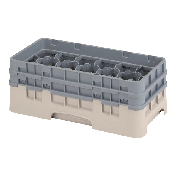 A beige and white plastic Cambro half size glass rack with 17 compartments and 2 extenders.