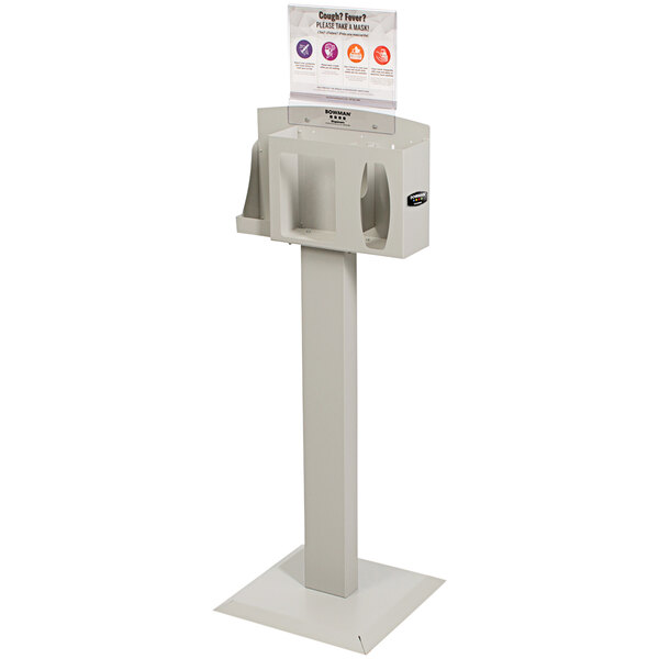 A white rectangular BOWMAN PPE dispenser with a sign holder on top.
