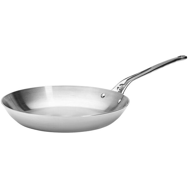 A close-up of a de Buyer stainless steel fry pan with a handle.