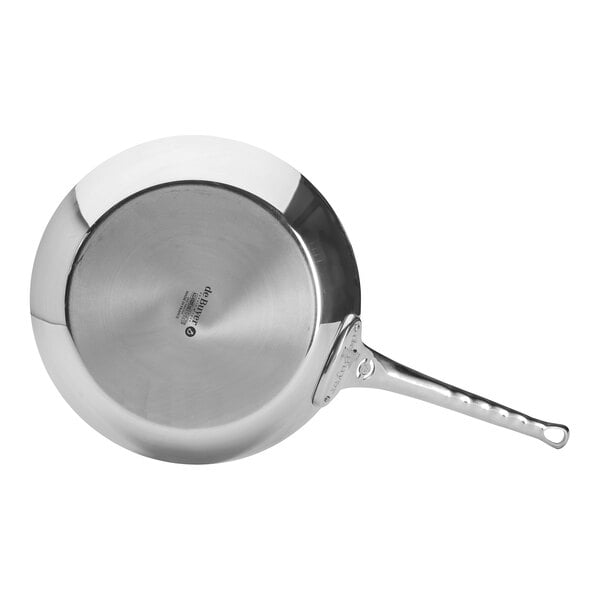 A de Buyer stainless steel fry pan with a handle.