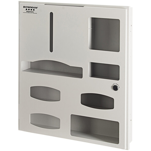 A beige powder-coated steel semi-recessed BOWMAN protective wear organizer with four compartments behind a white door with holes.