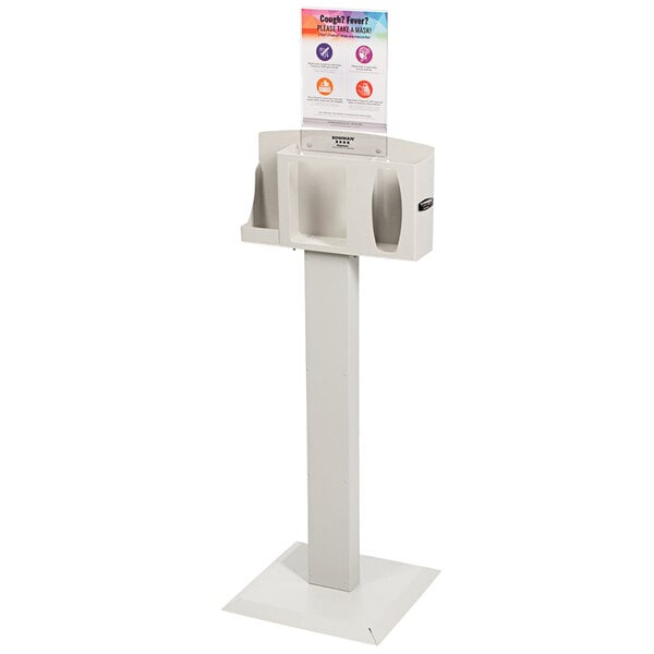 A beige Bowman PPE dispenser stand with a white rectangular box on it with a sign that reads "Cover Your Cough"
