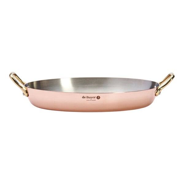 A de Buyer copper au gratin pan with handles.