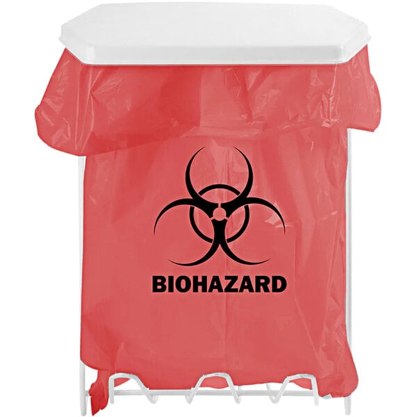 A BOWMAN white coated wire biohazard bag holder with a red biohazard bag and black biohazard symbol on it.