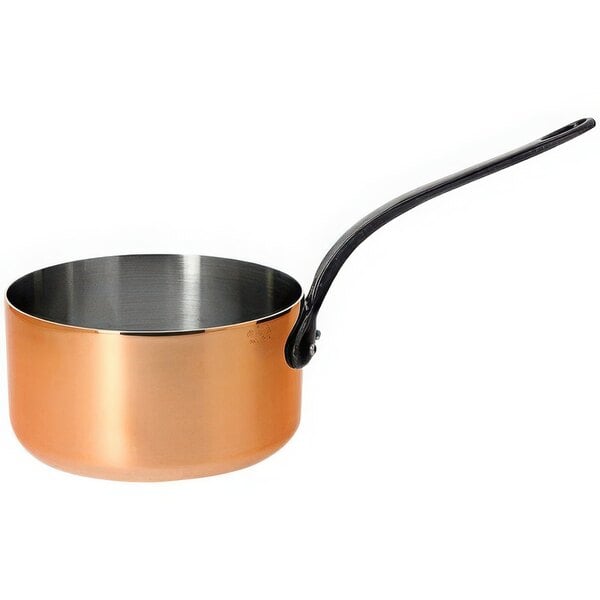 A de Buyer copper saucepan with a metal handle.