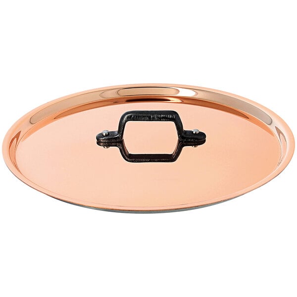 A de Buyer copper lid with a handle.