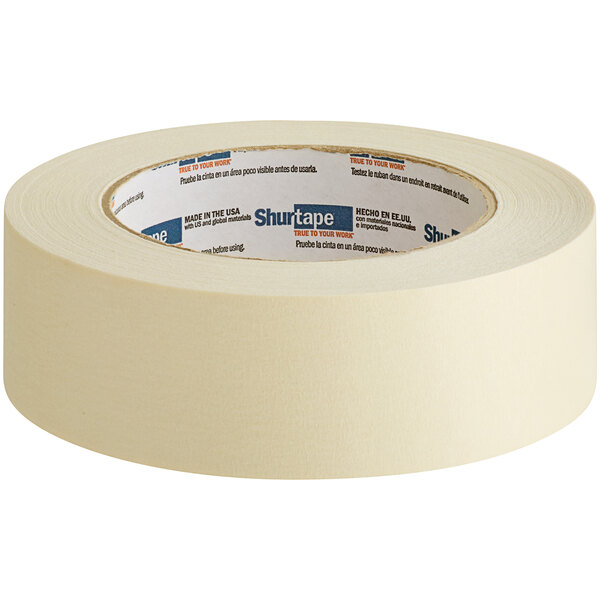 A roll of Shurtape natural masking tape with text on it.