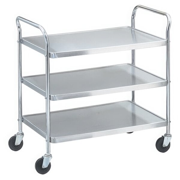 A silver stainless steel Vollrath utility cart with three shelves and black wheels.