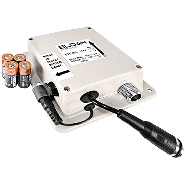 A Sloan control module with black cables and batteries.