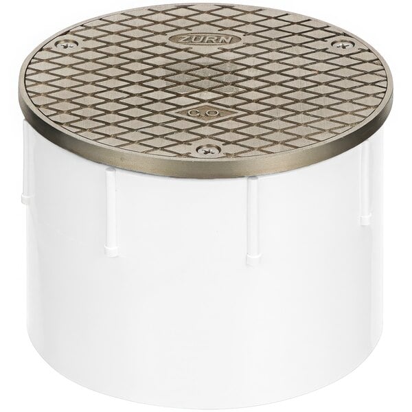 A white round ABS cleanout cover with a nickel lid.
