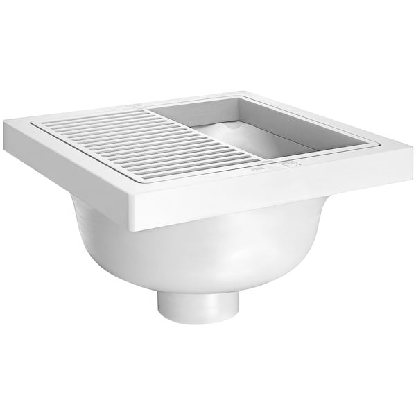 A white Zurn floor sink with a plastic sediment bucket inside.