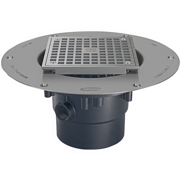The nickel bronze deck plate and metal grate for a Zurn Elkay adjustable PVC floor drain.