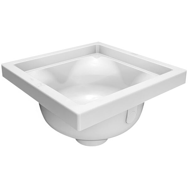 A white Zurn floor sink with a square top.