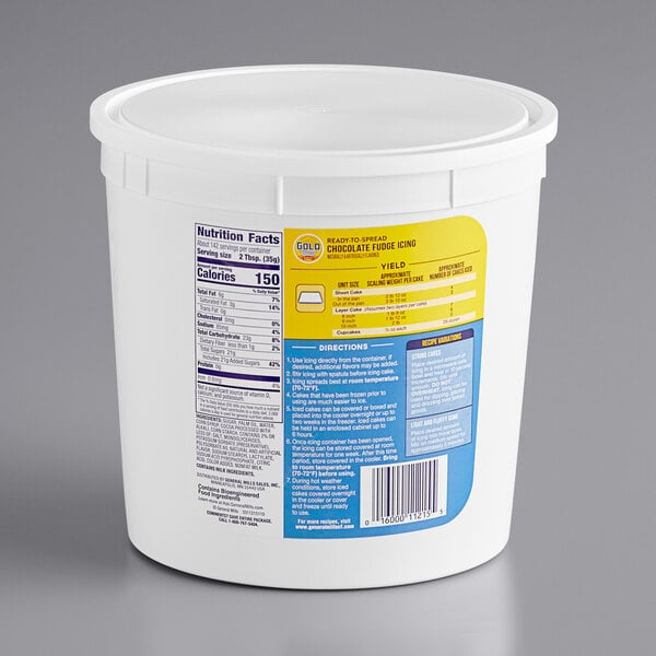 A white container of Gold Medal Ready-to-Spread Chocolate Fudge Icing with a yellow label.