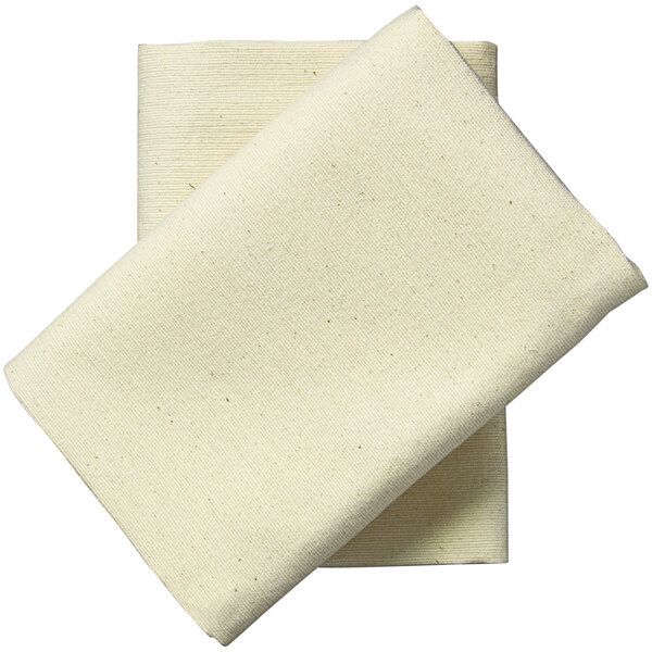 Two folded white Garnier-Thiebaut cloth napkins.