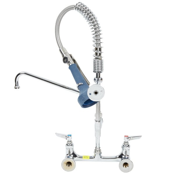 A T&S wall mounted pre-rinse faucet with a hose attached to it.