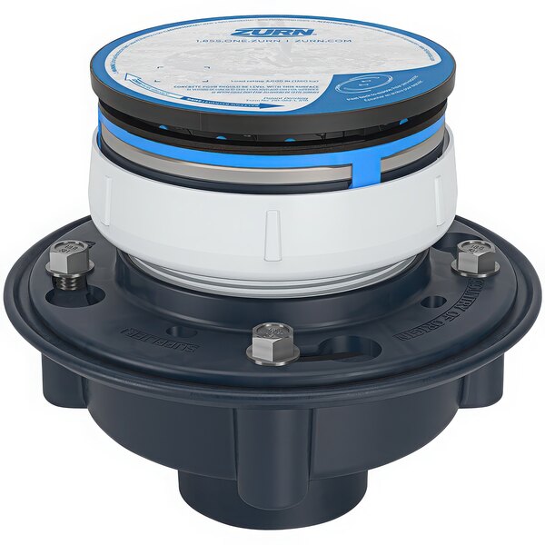 A round black and white Zurn floor drain strainer with a blue circle in the center.