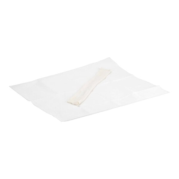 A rectangular white cloth with a long, narrow fabric cover placed on top.