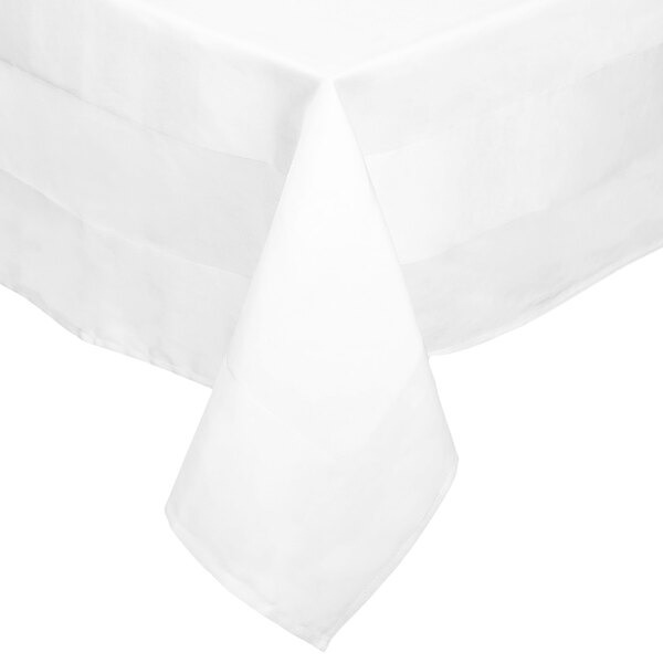 A close-up of a white tablecloth with black crossbordered lines.