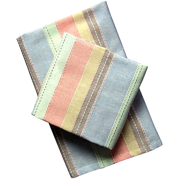 A stack of colorful striped Garnier-Thiebaut cloth napkins.