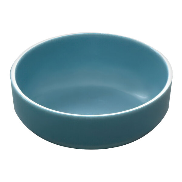 A blue bowl with a white rim.