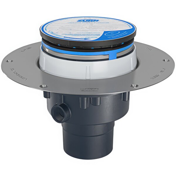 A Zurn floor drain with a round stainless steel head and blue and white PVC valve.