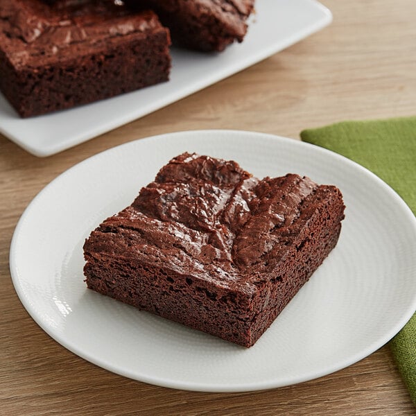 A Pillsbury Bakers' Plus brownie on a white plate.