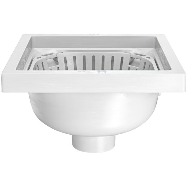 A white Zurn floor sink with a plastic sediment bucket and drain.