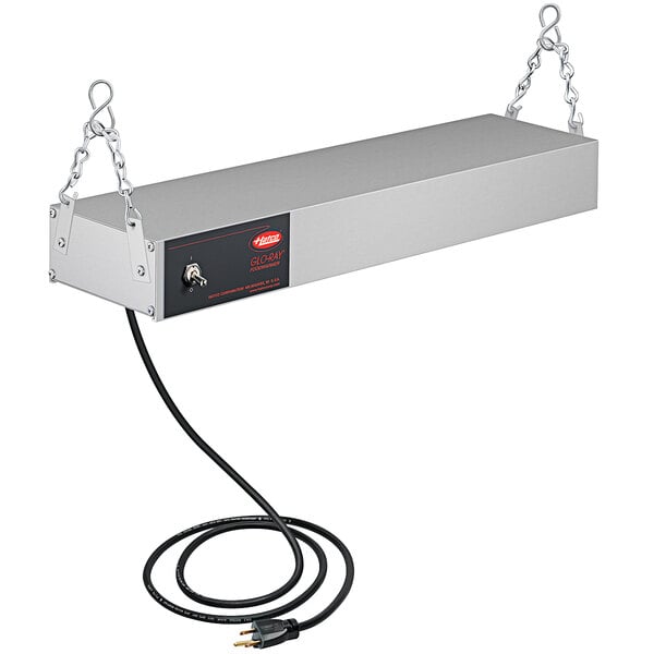 A rectangular metal Hatco food warmer with a wire attached to it.