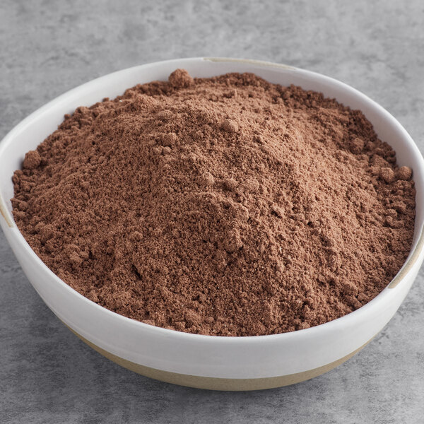 A bowl of brown Gold Medal Chocolate Chocolate Cake mix powder.