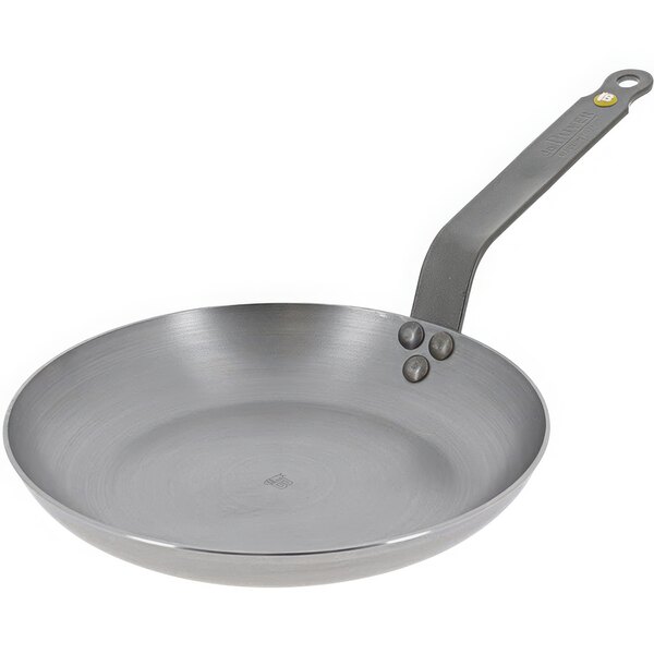 A de Buyer carbon steel frying pan with a stainless steel handle.