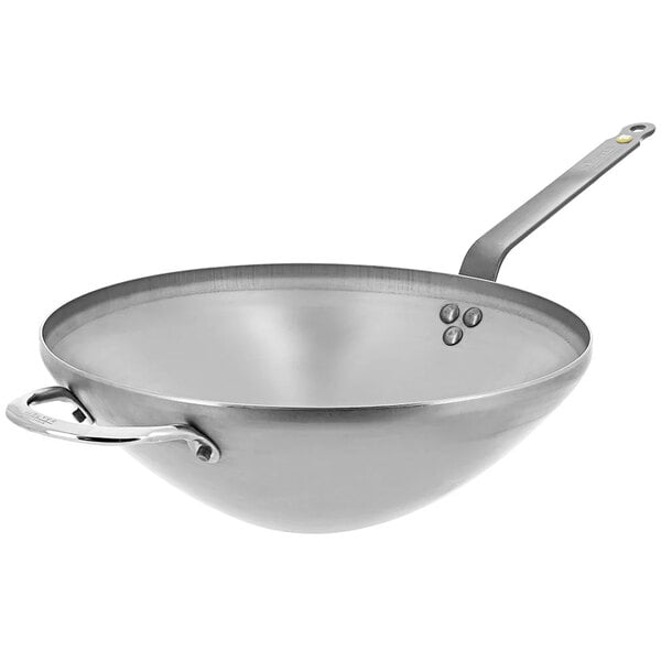 A de Buyer carbon steel wok with a helper handle.