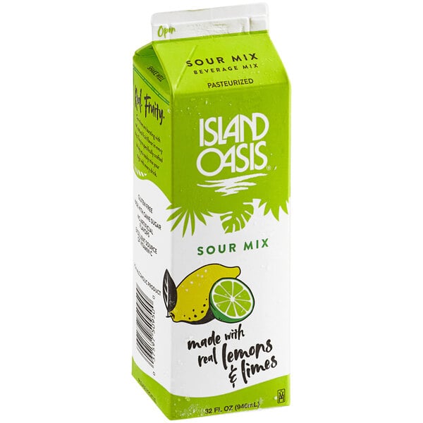 A white and green carton of Island Oasis Sour Beverage Mix with lemons and limes.