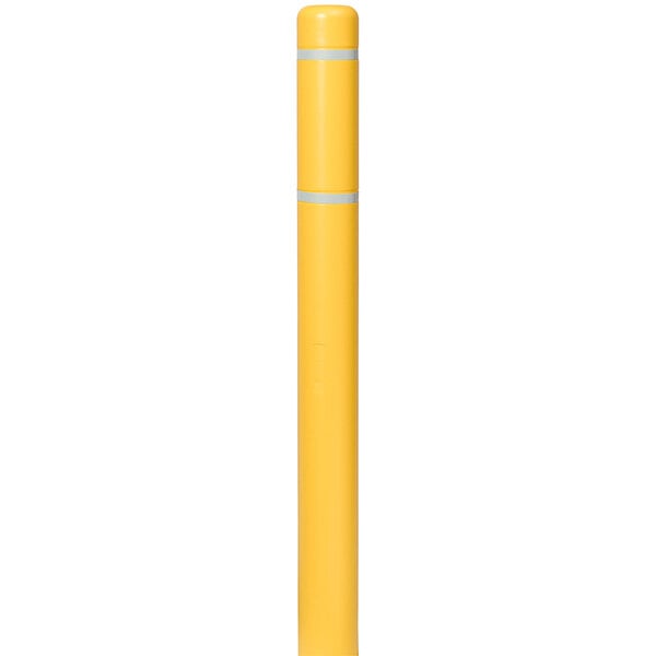 A yellow Innoplast BollardGard cover with white reflective stripes on it.